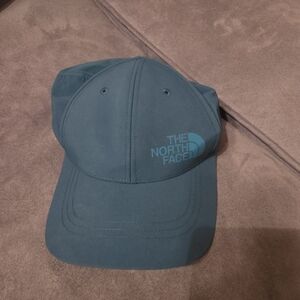 The North Face Blue Cap. Flex Style. Hole For Ponytail. Excellent Cond